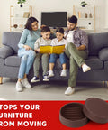 Family sitting on a couch with Heavy Duty Rubber Furniture Floor Protectors 2x2 Round Caster Cups Anti Slip Bed Stopper visible on floor.