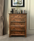 Wooden dresser with 10 Pack Black Round Mushroom Cabinet Knobs For Dresser And Drawer 1.5 Inch Diameter in a cozy room setting.