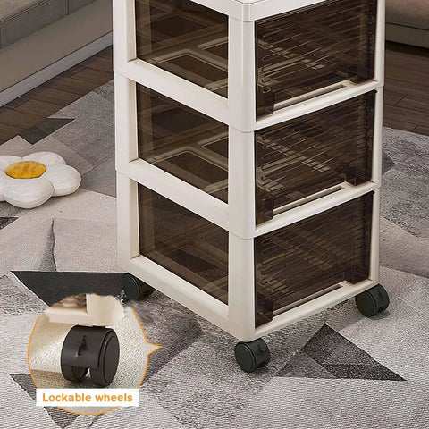 Multitasking Rolling Storage Cart With Sturdy Plastic Drawers And Smooth Gliding Swivel Wheels, showcasing lockable wheels and three clear drawers.