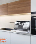Real Deal Compact Countertop Dishwasher For Modern Kitchens Clean Cycle For Six Place Settings With A Durable Stainless Steel Tub and Super Chill Quiet Operation No Sweat Push Button Controls Space Savvy Portable Mini Washing Machine In Fresh White shown in use with plates and utensils inside.