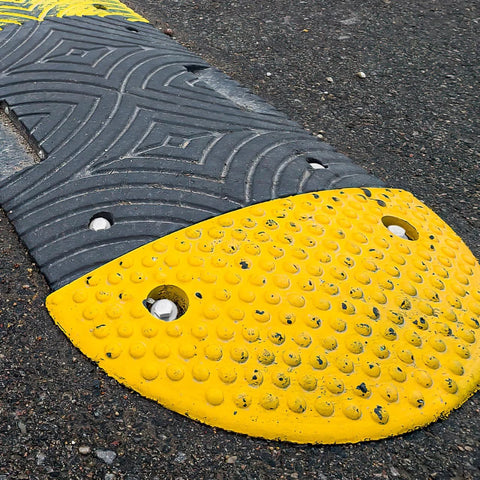 Driveway Expansion Screws For Speed Bump Installation And Concrete Asphalt Anchoring Ground Screw Anchors 3.7 Inch Expansion Fasteners in use on asphalt.