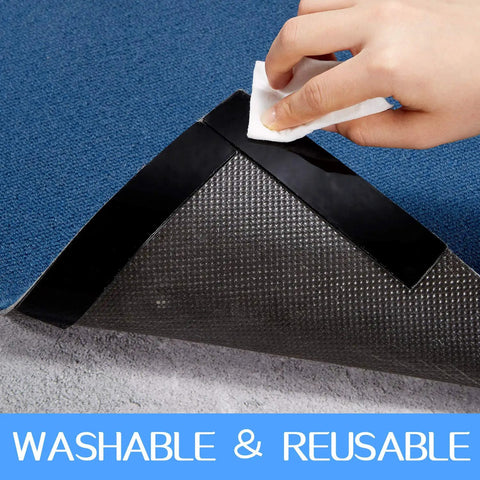 Hand using 32 Piece Rug Gripper Set Anti Slip Corner Pads And Washable Sticky Protectors For Hardwood Floors And Tile, 16 Round And 16 Oblong Pads, Black, Keeps Rugs From Sliding And Shifting On Any Surface under a blue rug.