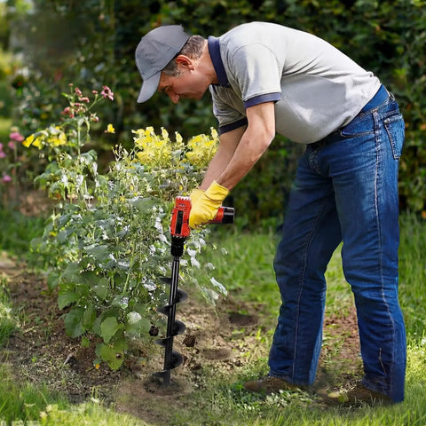 Person using Heavy Duty 4 By 16 Inch Garden Auger Drill Bit For Planting And Post Hole Digging Spiral Bulb Planter Tool outdoors