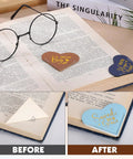 Fourteen Genuine Leather Heart Bookmarks With Uplifting Bible Verses shown marking pages in a book, demonstrating soft texture and design.