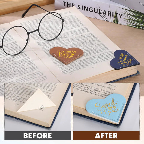 Fourteen Genuine Leather Heart Bookmarks With Uplifting Bible Verses shown marking pages in a book, demonstrating soft texture and design.