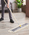 Heavy Duty Cut End Cotton Dust Mop Head For Commercial Tiles 36 Inch Wide Disposable Floor Care Tool For Stubborn Debris Cleanup in use.