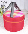 Round insulated lunch bag with red exterior, checkered pink and orange lid, and black handles on white background