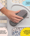 Hand operating one-hand lock on pressure mounted easy fit baby gate with memory feature fits 28 to 40 inches taupe one hand lock