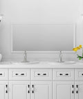 Double sink with Single Control Bathroom Sink Faucet Featuring Pop Up Drain In Polished Chrome All Metal Construction in a white bathroom.