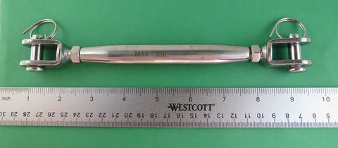 AISI 316 Marine Grade Stainless Steel Turnbuckle Rigging Screw Jaw To Jaw Assembly With Locking Nuts shown next to a ruler for size reference.