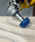 Badass Two Inch Tungsten Carbide Contour Wheel For Die Grinders shaping wood surface during material removal.
