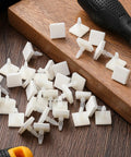 100 Pcs Sticky PCB Spacers Adhesive Insulated Standoffs 0.25 Inch Height displayed on wooden surface with tools