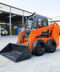 Skid steer loader with Quick Connect System for Skid Steer Attachments parked in urban jobsite.