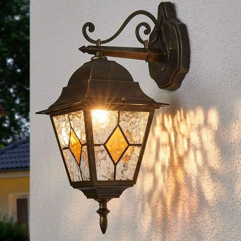 Outdoor vintage-style lantern with stained glass, mounted on wall, A19 LED Dusk To Dawn Filament Bulb For Outdoor Use lighting scene