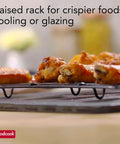 Nonstick 15 X 10.5 Inch Baking Pan With Raised Wire Rack For Crispy Bacon, Chicken And Fries, shown with chicken wings