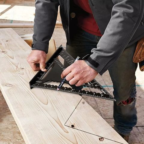 Craftsman using Dead On Twelve Inch Aluminum Rafter Square Top Shelf Carpenter Triangle Ruler for marking wood angle.