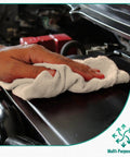 Hand using Cotton Shop Towels Pack Of 150 14 By 12 Inches White Reusable Shop Rags for Cars Garage Industrial