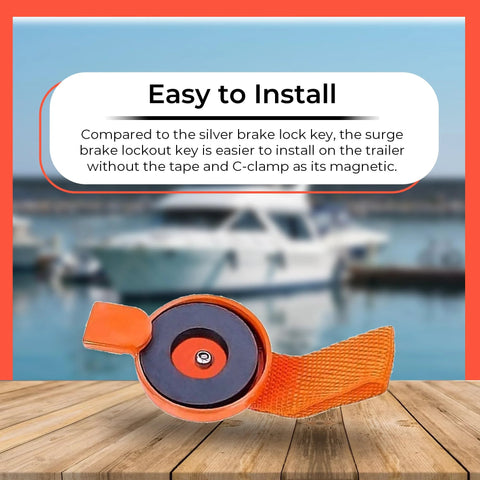 Orange surge brake lockout key with magnetic disc and heavy-duty strap for UFP boat trailer