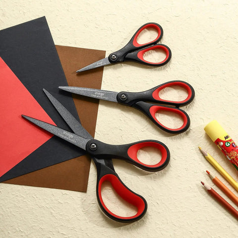 Workhorse Three Pack Titanium Coated Scissors Set For All Purpose Use, Nonstick Teflon Blades, Heavy Duty Office Shears, Sharp Stainless Steel, Multipurpose Cutters For Paper, Fabric, Cardboard And More. Three black and red scissors on paper and craft supplies