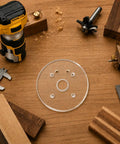 Six Inch Clear Acrylic Router Base Plate With Precision Pre Drilled Holes For DWP611 And DCW600B Compact Routers on workbench with tools.