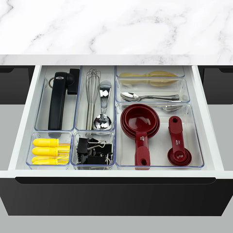 7 Piece Drawer Organizer Set With 4 Different Sizes Clear Crystal Plastic Trays For Office Home Makeup Kitchen And Junk Drawer Modular Build For Customizable Storage And Easy Grab And Go Organization showing organized kitchen utensils.
