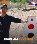 Man outdoors holding the Beefy AR500 Steel Target Silhouette Built Tough For Real Range Sessions 12 By 20 Inches with 6 Inch Center Paddle.
