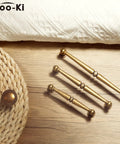 6 Pack Antique Brass Cabinet Handles Zinc Alloy Drawer Pulls For Kitchen And Furniture on a wooden surface, classic rustic hardware.