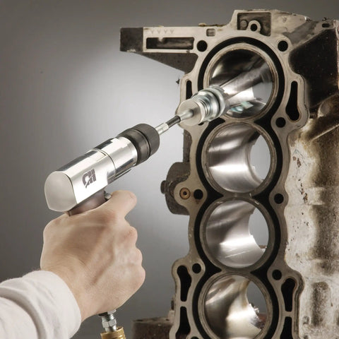 Three Eighths Inch Reversible Air Drill With Keyless Chuck drilling metal engine block, 5.2 CFM at 90 PSI, quick reverser