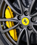 Close-up of a car wheel with yellow brake caliper, suitable for Rim EVO 30ml Ceramic Wheel Coating Kit For Rims High Heat Resistant Up To 1400F.