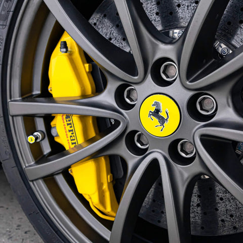 Close-up of a car wheel with yellow brake caliper, suitable for Rim EVO 30ml Ceramic Wheel Coating Kit For Rims High Heat Resistant Up To 1400F.