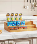 Expandable Bamboo Can Rack Organizer For Pantry With Three Tier Telescopic Design Holds Twenty Four Soda Cans on kitchen counter.
