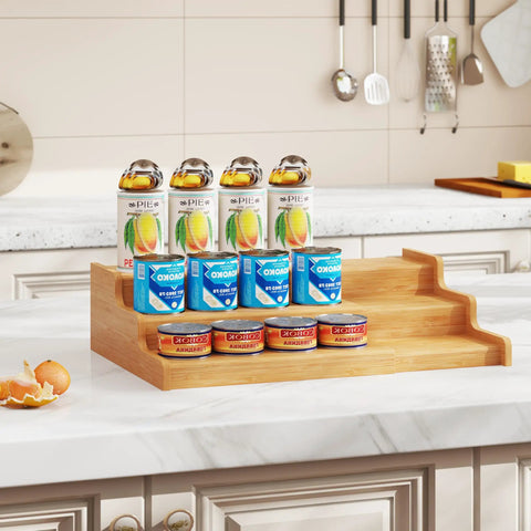 Expandable Bamboo Can Rack Organizer For Pantry With Three Tier Telescopic Design Holds Twenty Four Soda Cans on kitchen counter.