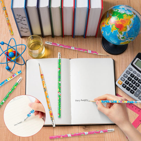 Writing with 60 Pcs Science Themed Pencils With Erasers Set for Classrooms and Labs next to a globe, calculator, and books
