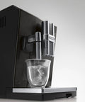 Real Deal Fully Automatic Espresso Machine With Single Touch Lattecrema Setup For Creamy Cappuccino Foam Black Coffee Maker pouring water.