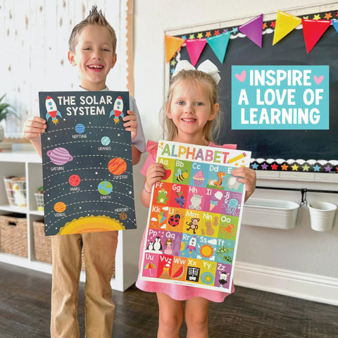 Children holding Laminated Preschool Poster Set For Toddlers And Kindergartners 16 Colorful Educational Posters in a classroom.