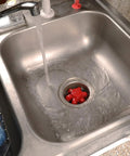 Disposal Genie II Garbage Disposal Strainer And Stopper, Kitchen Sink Drain with Splash Guard, Black Finish in use
