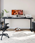 Fitstand Extra Large Standing Desk Dual Motor Electric Height Adjustable Sit Stand Workstation with monitor and office chair.