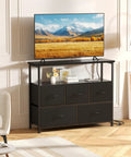Compact Media Console And Dresser Combo With Five Fabric Storage Drawers Open Shelf For TV Space Saving Entertainment Unit For Bedroom Living Room Or Dorm Black Finish With Easy Setup And Cable Management in living room setting