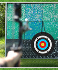 Backyard Ready 24 Inch EVA Foam Archery Target Block With Pins For Easy Backyard Practice Includes 20 Paper Arrow Targets Rubber Arrow Puller And Spike Stakes For Compound Bow Shooting in use