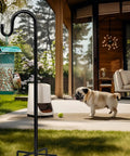 Heavy Duty 48 Inch Shepherd Hook Garden Pole For Outdoor Use That Holds Bird Feeders Planters Lanterns Solar Lights Wind Chimes Birdbaths And Yard Decor With A Five Prongs Base One Pack Easy Assembly Weather Resistant installed in a garden with feeding birds.