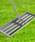 48 Inch Wide Lawn Leveling Rake With 52 To 78 Inch Adjustable Telescopic Handle Heavy Duty Stainless Steel Leveler Tool on grass