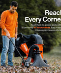Gas Powered Leaf Vacuum And Wood Chipper Combo With 7HP 209cc Engine used on grass for yard cleanup, man holding vacuum hose.
