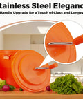 Heavy Hitter Commercial Salad Spinner With 5.5 Gallon 20 Quart Capacity showing orange plastic body and stainless steel lid handle.
