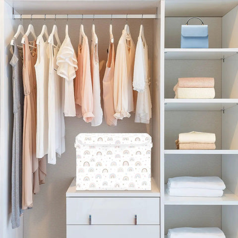 Heavy Hitter Collapsible Storage Bin With Secure Flip Top Lid And Reinforced Carry Handles For Bedroom Walk In Closet Living Room And Home Office Quick Setup No Sweat Compact Fold Toy Box Organizer in a closet with clothing.