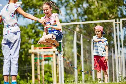 Kids using Double Dutch Jump Rope Set 16.4 Ft 2 Pack With Beaded Plastic DIY Segmented Rope in outdoor activity
