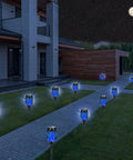 12 Pack Solar Tiki Torch Lights Outdoor Waterproof Blue Flickering Flame for yard lighting along garden pathway at night