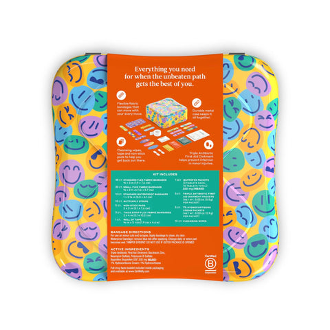Welly first aid kit tin with colorful emoji-pattern wrap and orange information panel.