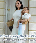 Mom holding baby and Top Shelf Portable Breastmilk Cooler Bottle with heavy duty insulation while exiting home.