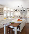 Wagon Wheel Chandelier 9 Light Black Metal Pendant for Dining Room and Kitchen Island in a modern farmhouse kitchen setting