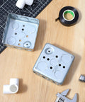 12 Pack 4 Inch Square Electrical Boxes 1-1/2 Inch Deep Galvanized Steel Junction Boxes For Wall Outlets And Wiring 21 Cu In Capacity Silver Finish Screws Not Included, shown open on a table with tools